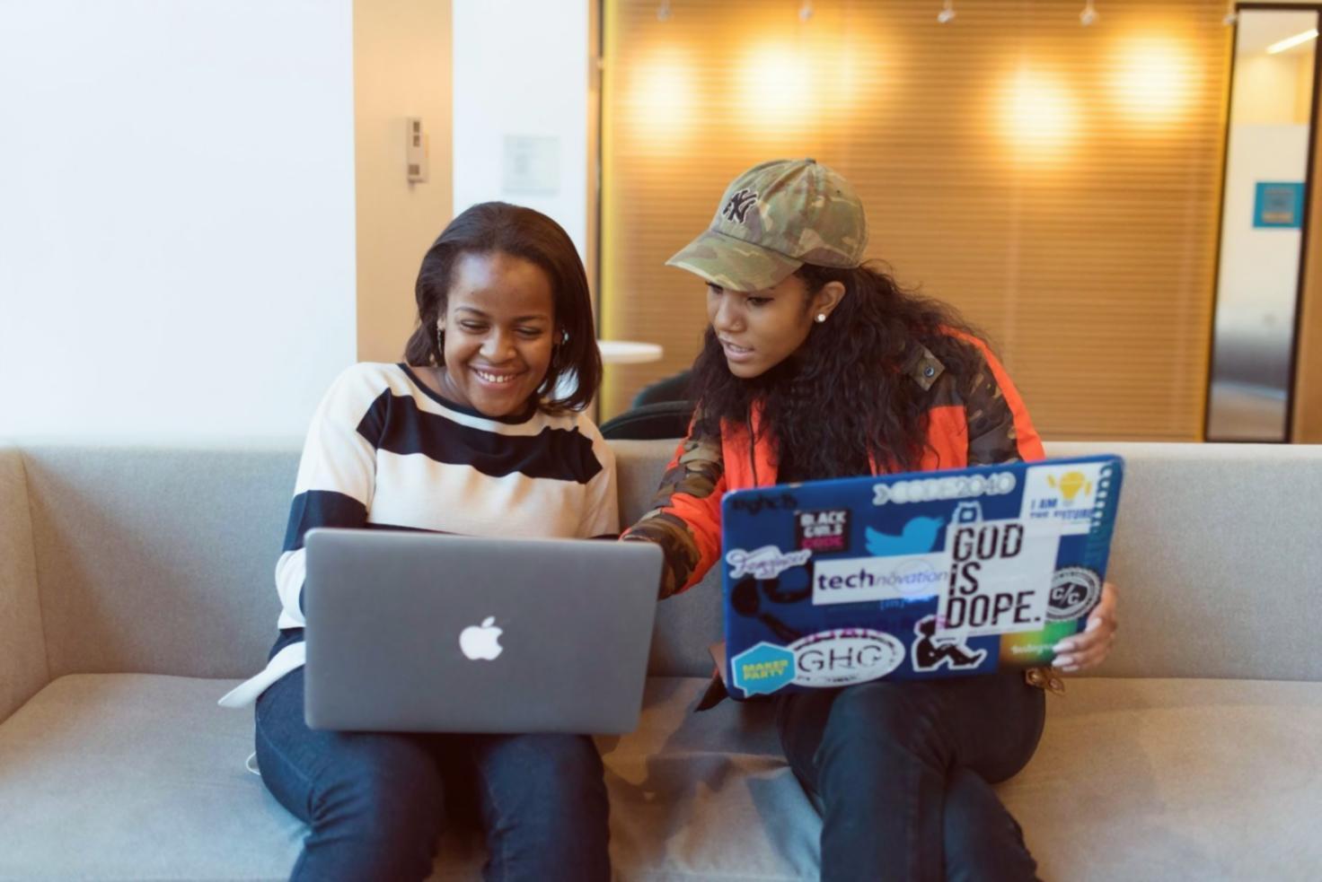 Students reviewing interface wireframes during a live seminar session